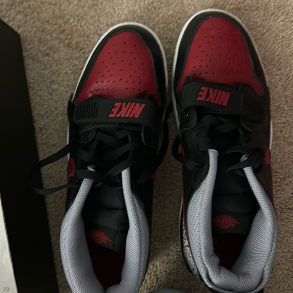 Black and red Jordan’s 312 low